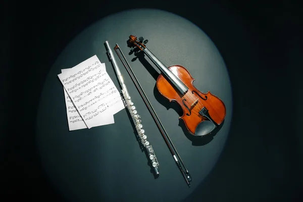 Violin and flute with music notes