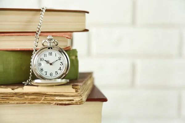 Clock and vintage books