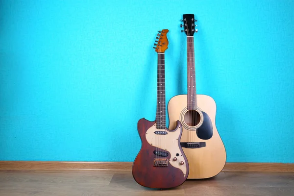 Guitars on blue wallpaper background
