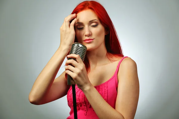 Young woman with microphone