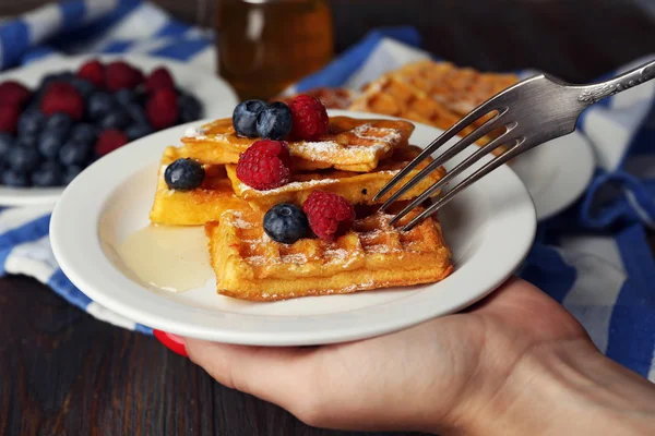Waffles with forest berries and sauce