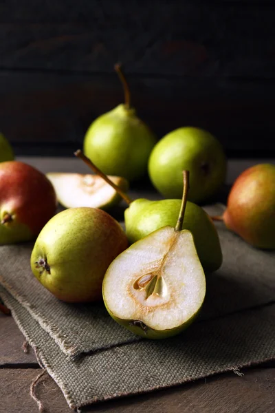 Ripe tasty pears on table close up