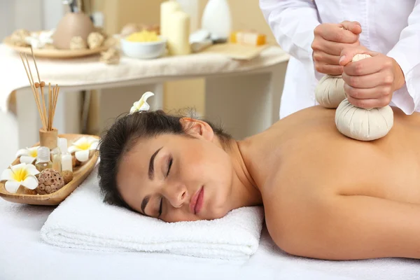 Young woman on massage table