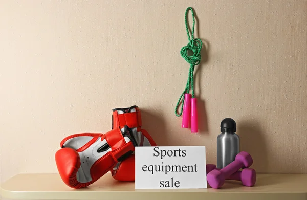 Sport goods for sale, on light wall background