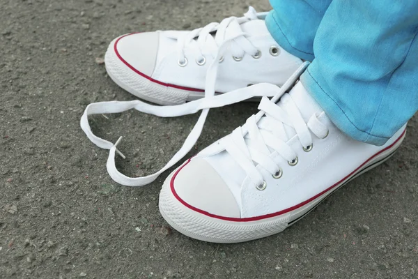 Female feet in gum shoes