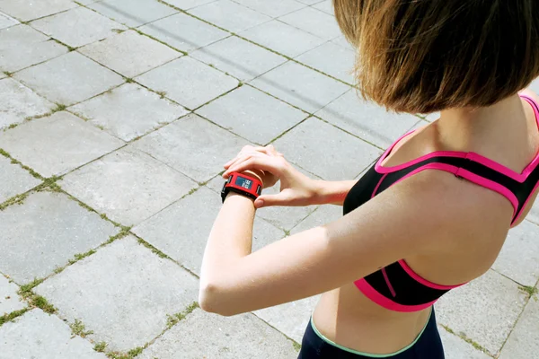 Runner looking at watch