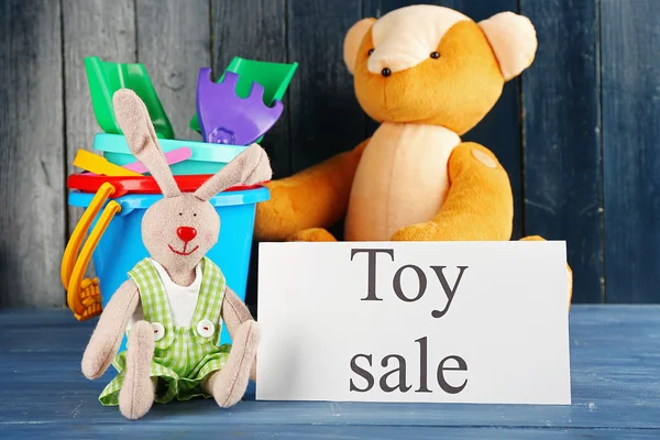 Toys for sale on wooden background