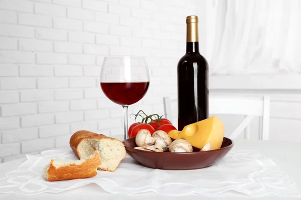 Set of products with wine bottle on light background