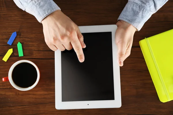 Man working with digital tablet, top view