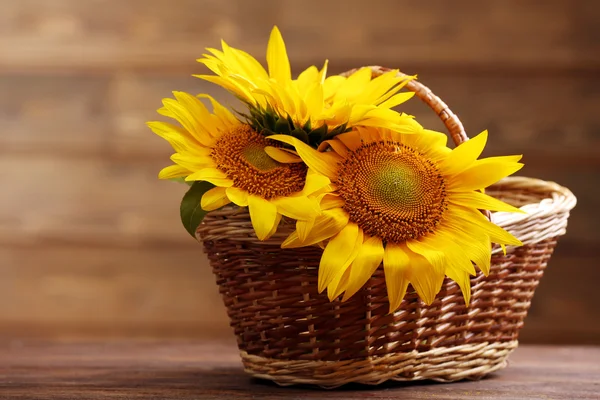 Beautiful bright sunflowers in basket