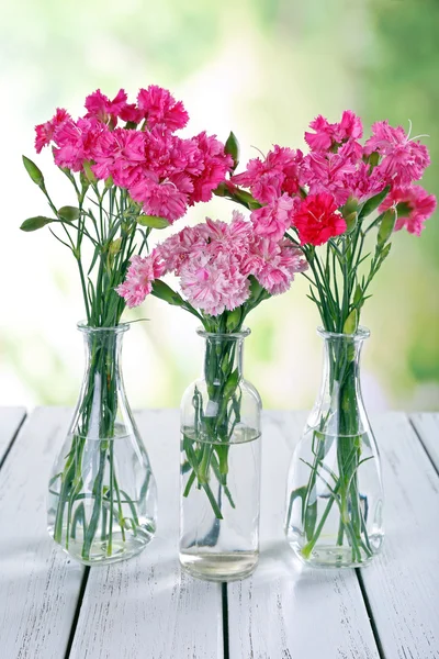 Beautiful bouquet of pink carnation in vases