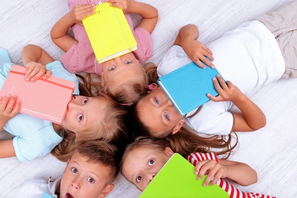 Top view of children in circle on floor