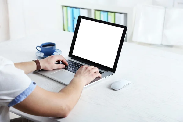 Man working with laptop in office