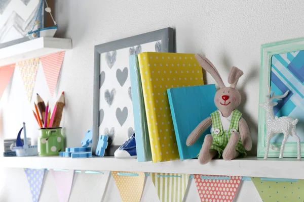 Shelves with toys in child room close-up