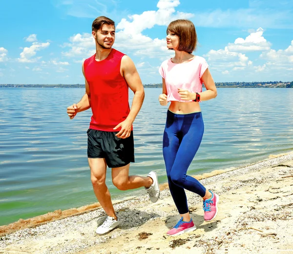 People jogging on beach