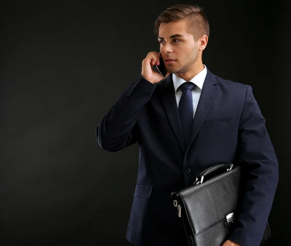 Elegant man in suit with briefcase