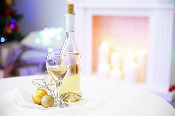 Bottle and glass of wine with Christmas decor