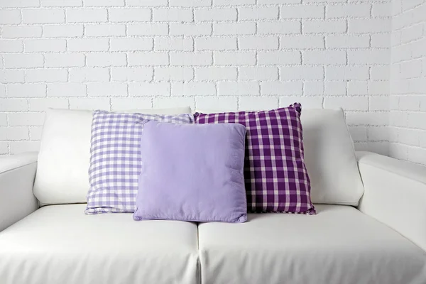 Colorful pillows on sofa