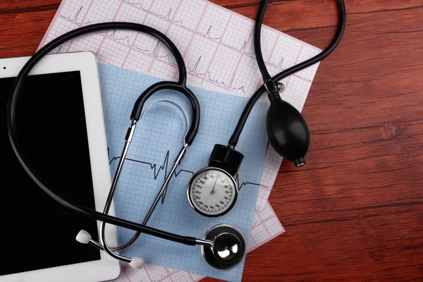 Blood pressure meter, tablet and stethoscope