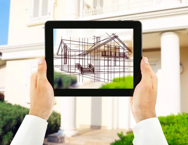 Architect showing new house project on tablet-pc, close up