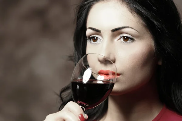 Portrait of beautiful woman drinking wine