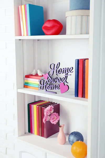 Books and decor in cupboard