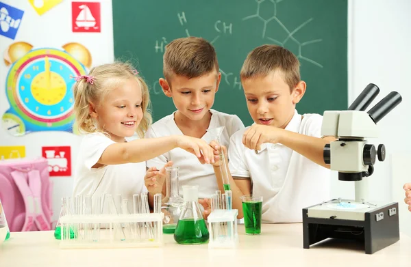 Cute pupils in chemistry class