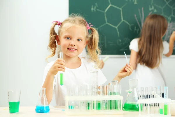 Cute pupils in chemistry class