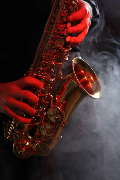 Musician in black shirt with sax