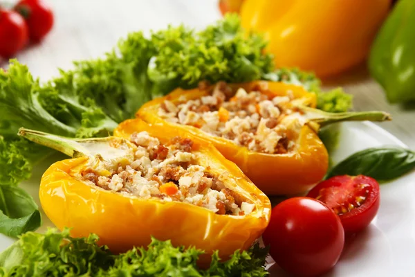 Stuffed peppers with vegetables on table close up