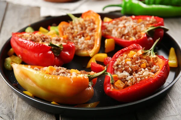 Stuffed peppers with vegetables on table close up