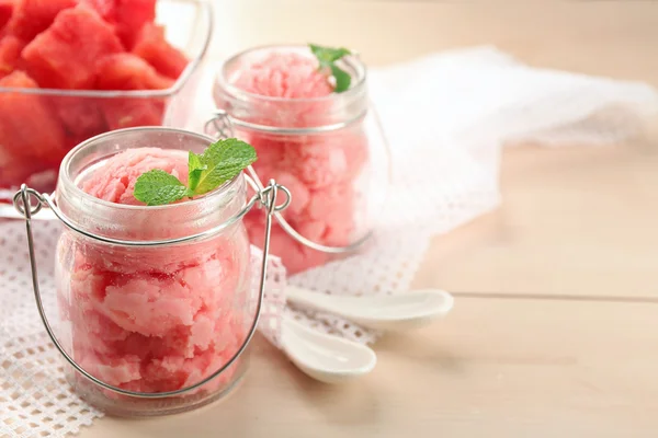 Watermelon ice cream in glass jars