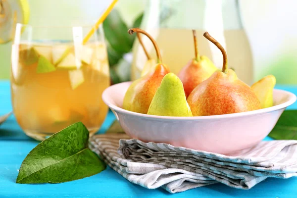 Fresh pear juice with fruit on table close up