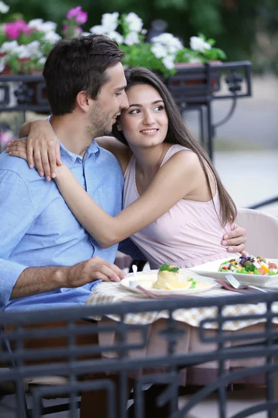 Young couple in street cafe