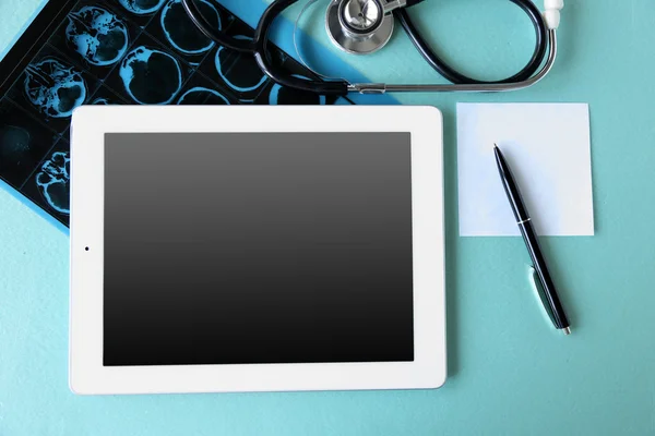 Medical tablet with screen empty screen on blue table