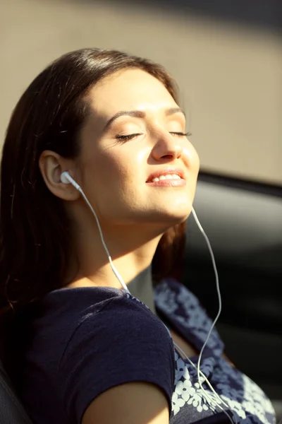 Young woman in the car outside