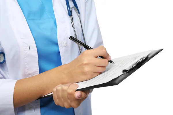 Smiling medical doctor writing in a folder, isolated on white, close-up