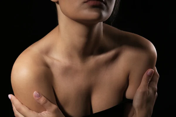 View on woman\'s neck, collarbone, breast and shoulders, close-up