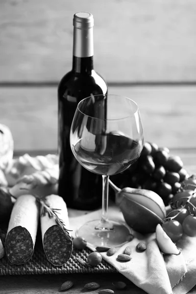 Still life with various types of Italian food and wine,  black and white retro stylization