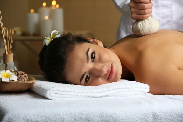 Young woman on massage table