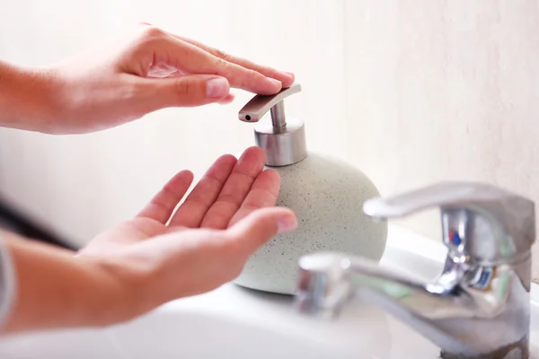 Washing of hands with soap