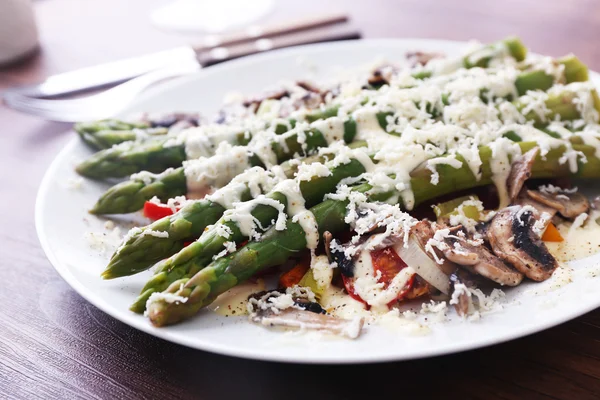 Delicious vegetables dish on served wooden table, close up