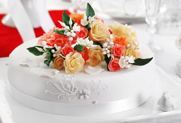 Beautiful cake with decorations for wedding or other celebration in restaurant, close-up