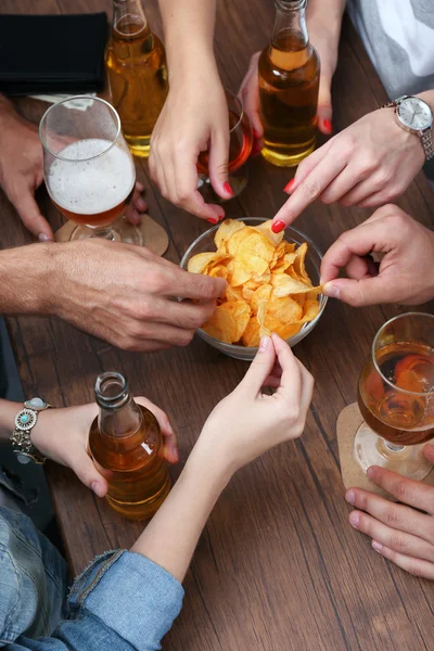 Friends having alcoholic drinks in the bar