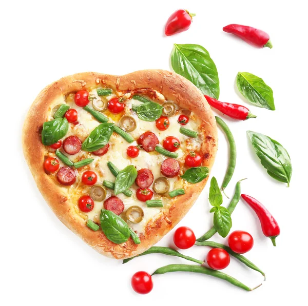 Tasty heart shaped pizza decorated with hot peppers and basil isolated on white background