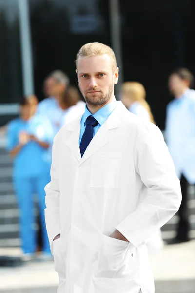 Handsome doctor with medical stuff