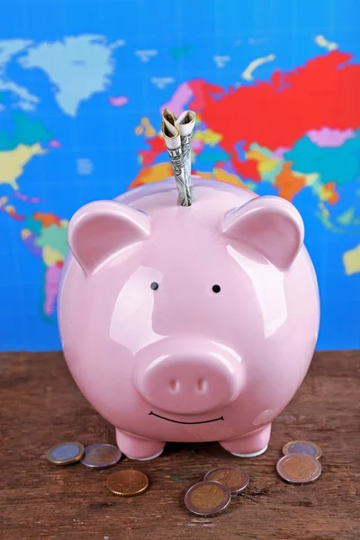 Piggy money box, banknotes and coins