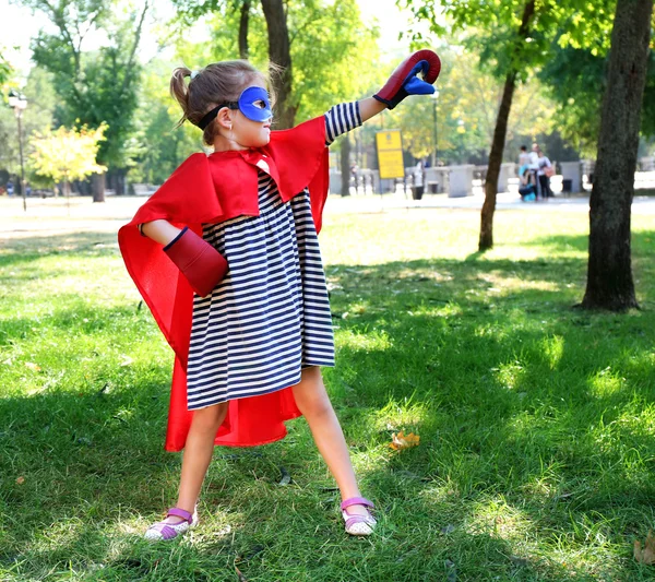 Little girl dressed as superhero