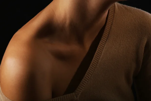 View on woman\'s neck, collarbone and shoulders, close-up