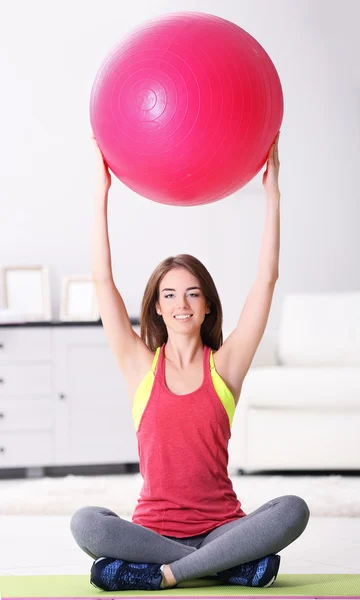 Girl doing exercises with fit ball